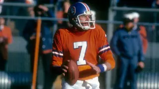 Quarterback Craig Morton dropping back to pass during an NFL game at Mile High Stadium