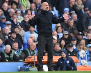 The Manchester City manager, Pep Guardiola, urges on his players during their 3-0 victory over Brentford