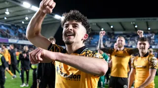 Hull City winger Mohamed Belloumi celebrates in front of his team-mates after their 2-0 win at Millwall