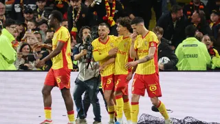 Lens' Portuguese midfielder #04 Mezian Mesloub Soares (C-R) is congratuled by teammates after scoring his team's first goal during the French L1 football match between RC Lens and FC Nantes at the Stade Bollaert-Delelis stadium in Lens on May 8, 2026.
