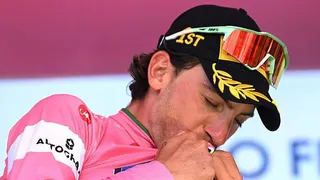 Giulio Ciccone celebrates wearing the leader's pink jersey
