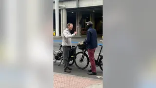 Benedict Cumberbatch arguing with a masked cyclist on St Pancras Road in London