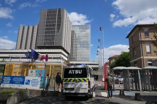 An ambulance enters Bichat Hospital where a woman who tested positive for hantavirus remains in intensive care in Paris on Tuesday. Photo: AP