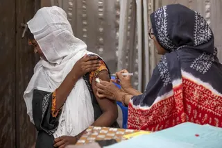 Family welfare official Tahmina (right) administering a birth control injection to a woman at the Savar Upazila Health Complex in Dhaka.