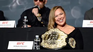 UFC women's bantamweight champion Ronda Rousey interacting with crowd at press conference
