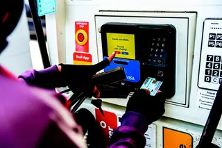 A motorist filling up his machine with subsidised RON95 petrol at a station. - NSTP FILEPIC