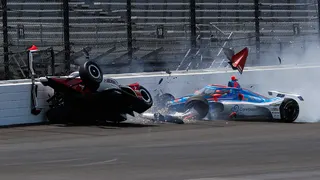 Katherine Legge and Stefan Wilson crashing in the first turn during Indianapolis 500 practice