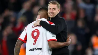 Tonda Eckert has a big smile on his face as he hugs Cyle Larin (LARIN 9) at the end of the match