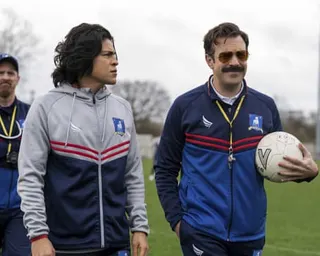 Cristo Fernández (left) with and Jason Sudeikis in a scene from Ted Lasso.