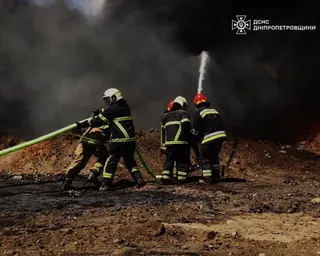 Emergency services personnel work to extinguish a fire following a Russian drone attack on a gas pipeline in Dnipropetrovsk region, Ukraine.