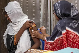 Family welfare officer Tahmina administers a birth control injection to a woman at the Savar Upazila Health Complex in Dhaka on April 27. Photo: AFP