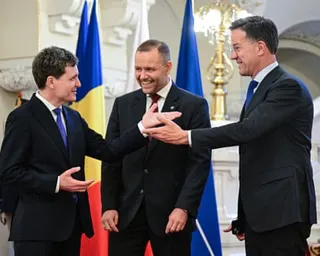 Nato general secretary Mark Rutte (R), Poland's President Karol Nawrocki (C) and Romania's President Nicușor Dan react during their meeting the presidential Cotroceni Palace in Bucharest.