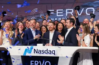 People applauding a new stock listing on the Nasdaq.