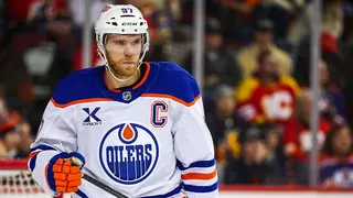 Connor McDavid skating on ice during hockey game at Scotiabank Saddledome