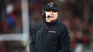 Georgia Bulldogs head coach Kirby Smart standing on the sideline at Sanford Stadium