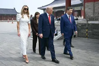 China's President Xi Jinping (right) and US President Donald Trump (centre) visit the Temple of Heaven in Beijing on May 14.