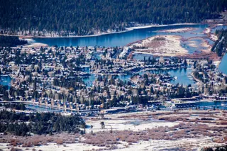 Aerial view of a residential area in South Lake Tahoe, with houses built on the shores of man made canals, California; sunny winter day.