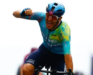 XDS Astana Team rider Davide Ballerini punches the air in triumph as he crosses the finish line in Naples to win the sixth stage of the Giro d'Italia.