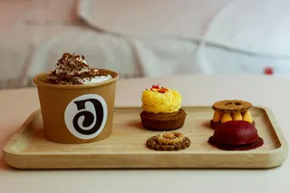 A trained pastry chef prepares the treats at this Paris dog bakery