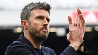 Manchester United caretaker head coach Michael Carrick applauds supporters after victory over Liverpool