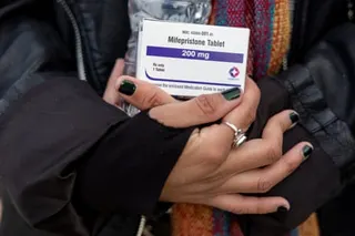 two hands holding a small box