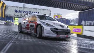 Forza Horizon 6 launch time date: A rally car riding through a track with shipping containers.