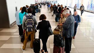 Passengers standing in TSA pre-check line at LaGuardia Airport in New York