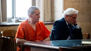 Former death row inmate Richard Glossip sits next to his lawyer Don Knight