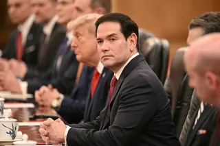 Secretary of State Marco Rubio (C) looks on as US President Donald Trump meets with China's President Xi Jinping.