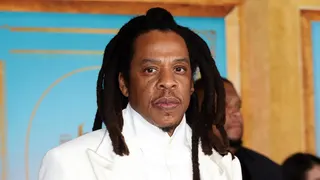 Jay-Z standing at the Los Angeles premiere of The Book Of Clarence