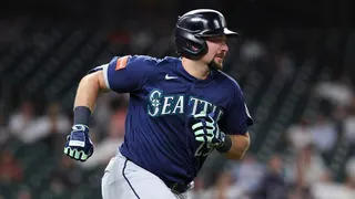 Seattle Mariners catcher Cal Raleigh running to first base at Daikin Park in Houston