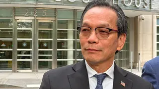 Lu Jianwang stands with his lawyer