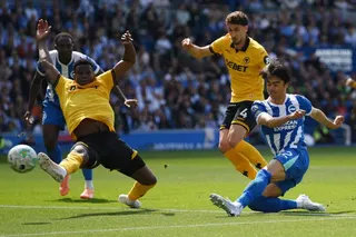 Brighton’s Kaoru Mitoma (right) shoots at goal against Wolves on Saturday before later going off with a hamstring injury that has ruled him out of the World Cup next month. Photo: Reuters