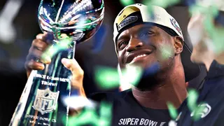 Kenneth Walker holds the Lombardi Trophy after the Seattle Seahawks win Super Bowl 60