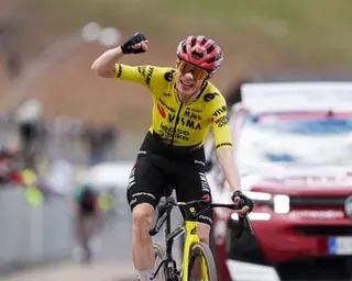 Visma-Lease a Bike rider Jonas Vingegaard celebrates as he heads to the finish line