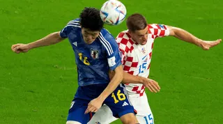 Tomiyasu Takehiro (left) vies with Croatia’s Mario Pasalic at the 2022 World Cup. Photo: Xinhua