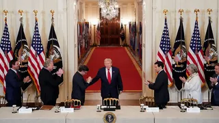 President Donald Trump greeting House Speaker Mike Johnson in the White House East Room