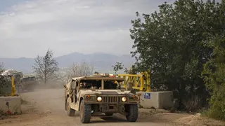 Israeli army soldiers patrol in their humvees along the border with southern Lebanon, in the Upper Galilee of northern Israel, on April 25, 2026