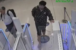 The tourist is seen on CCTV kicking the autogates when they do not open for him. Photo: Handout