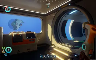 A player base interior from Subnautica 2, showing part of a square room with a processing unit and a submarine visible through the window beyond, and a tunnel on the right with vertical windows.