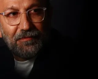 A close up of a bearded man, the film director Asghar Farhadi.