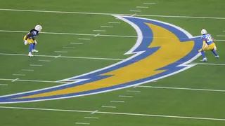 A kickoff during a football game between the Las Vegas Raiders and Los Angeles Chargers at SoFi Stadium