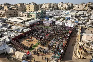 People gather during a mass-wedding celebration for Palestinian brides and grooms organised by the Turkish Humanitarian Relief Foundation (IHH) in Gaza City on May 11, 2026. — AFP pic