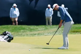 Alex Smalley putts on the 1st