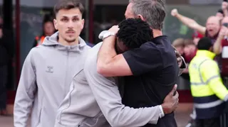 Hearts striker Pierre Landry Kabore is consoled by head coach Derek McInnes