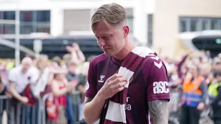Hearts centre-half Frankie Kent arrives back at Tynecastle in tears