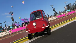 Forza Horizon 6: A palyer driving with a tiny red car around the Horizon Festival grounds.
