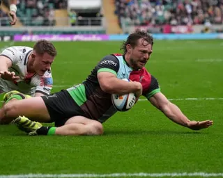 Will Evans slides home in front of the Twickenham crowd for Harlequins’ fifth try.