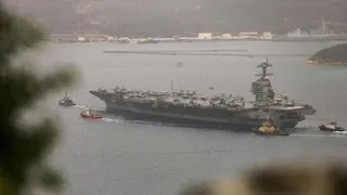 US aircraft carrier returns to naval base in Virginia after protracted 11 months of operations