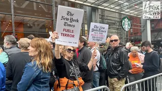 Protester holds signs